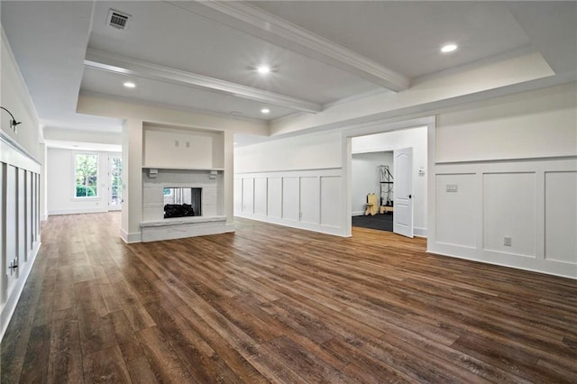 unfurnished living room with dark wood-type flooring, beamed ceiling, and a multi sided fireplace