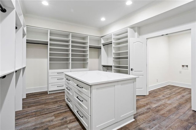 walk in closet featuring dark wood-type flooring