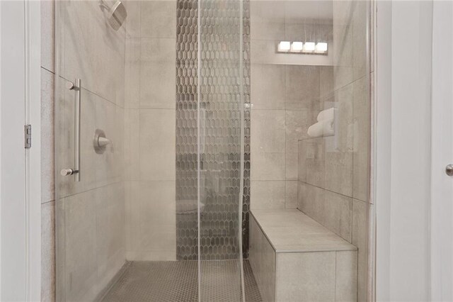 855 Peachtree St NE Unit 1311, Atlanta, GA 30308 - ensuite bathroom with vanity, tile patterned flooring, baseboards, and a shower