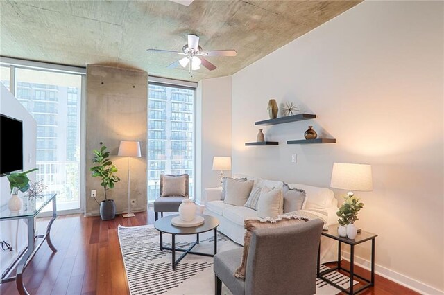 855 Peachtree St NE Unit 1311, Atlanta, GA 30308 - living room featuring floor to ceiling windows, wood finished floors, ceiling fan, and baseboards