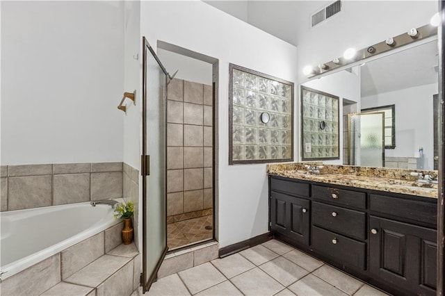 475 Shadetree Ln, Lawrenceville, GA 30044 - bathroom with a stall shower, a bath, tile patterned flooring, and double vanity