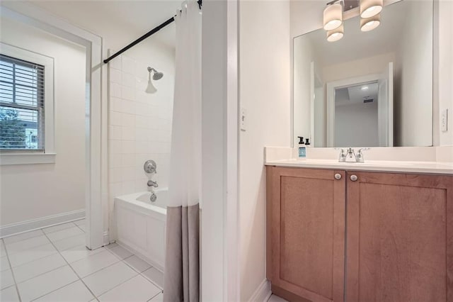 bathroom with tile patterned flooring, vanity, and shower / tub combo