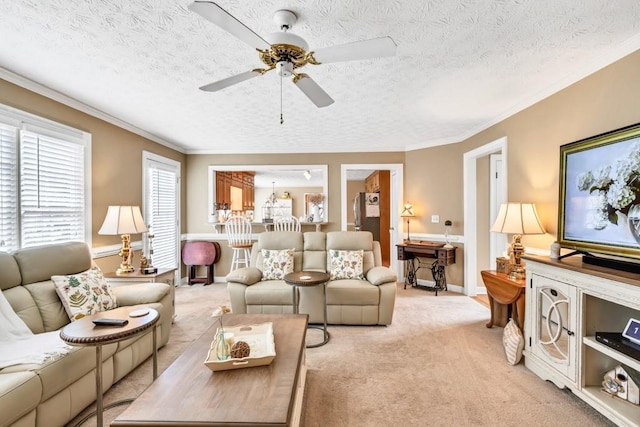 3574 Timberloch Trl, Snellville, GA 30039 - living room featuring light carpet, a ceiling fan, crown molding, a textured ceiling, and baseboards