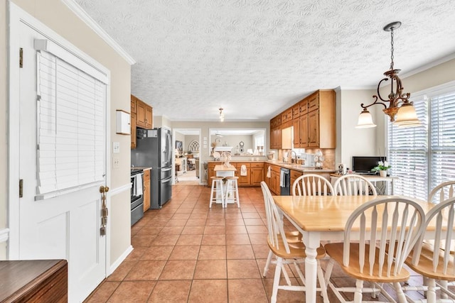 3574 Timberloch Trl, Snellville, GA 30039 - dining room featuring light tile patterned flooring, ornamental molding, and a textured ceiling