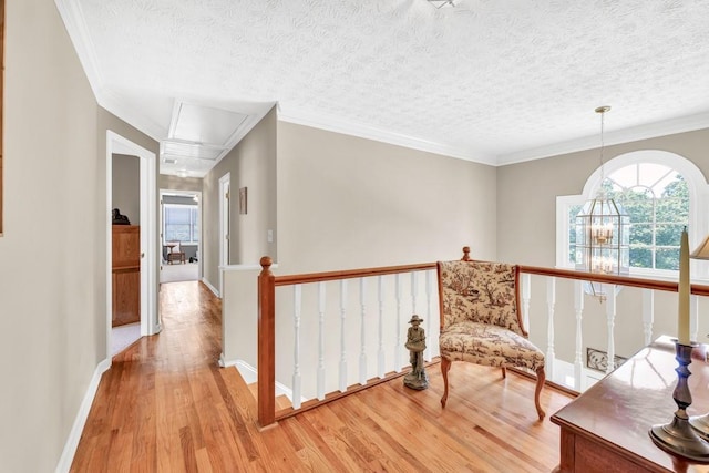 3574 Timberloch Trl, Snellville, GA 30039 - sitting room with an upstairs landing, attic access, light wood finished floors, a textured ceiling, and baseboards