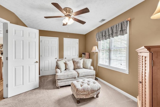 3574 Timberloch Trl, Snellville, GA 30039 - living room featuring light carpet, a ceiling fan, baseboards, and a textured ceiling