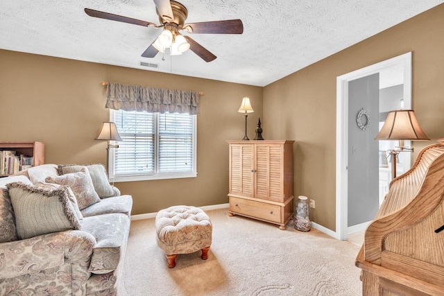 3574 Timberloch Trl, Snellville, GA 30039 - living area with a ceiling fan, baseboards, a textured ceiling, and carpet