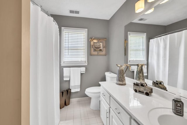 3574 Timberloch Trl, Snellville, GA 30039 - bathroom featuring toilet, vanity, tile patterned flooring, baseboards, and curtained shower