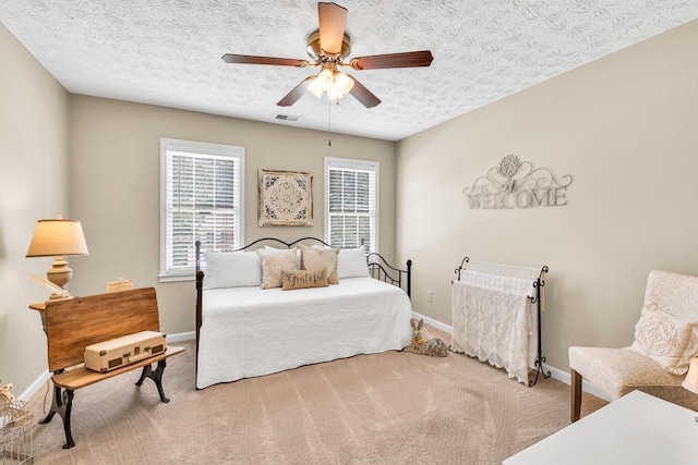 3574 Timberloch Trl, Snellville, GA 30039 - bedroom with baseboards, carpet floors, a textured ceiling, and ceiling fan