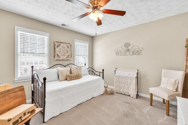 3574 Timberloch Trl, Snellville, GA 30039 - carpeted bedroom with baseboards, a ceiling fan, and a textured ceiling