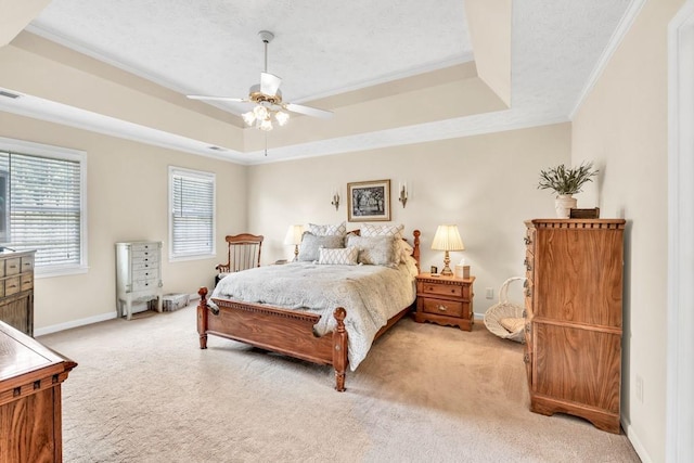 3574 Timberloch Trl, Snellville, GA 30039 - bedroom featuring a raised ceiling, light carpet, crown molding, baseboards, and a ceiling fan