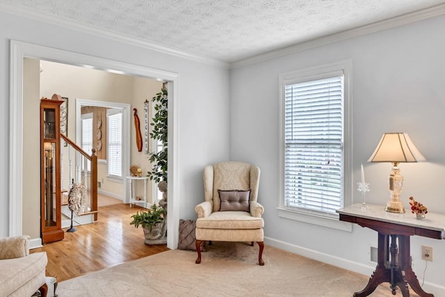3574 Timberloch Trl, Snellville, GA 30039 - sitting room with healthy amount of natural light, crown molding, baseboards, a textured ceiling, and wood finished floors