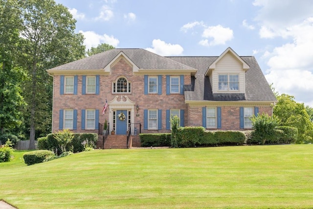 3574 Timberloch Trl, Snellville, GA 30039 - georgian-style home with a front lawn, brick siding, and a shingled roof