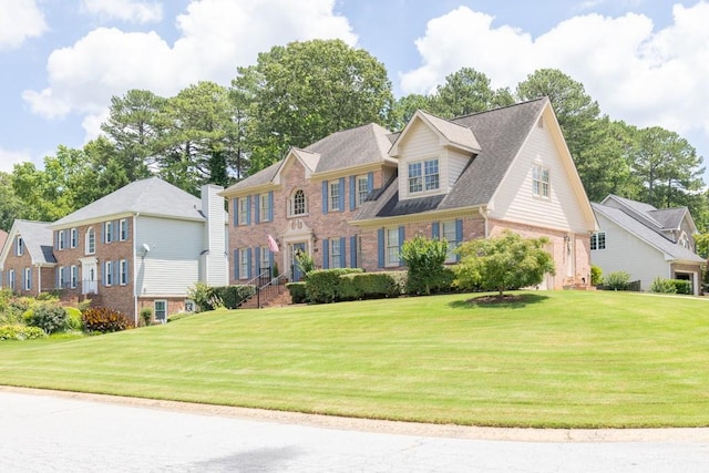 3574 Timberloch Trl, Snellville, GA 30039 - view of front of house featuring brick siding, a front yard, and a residential view