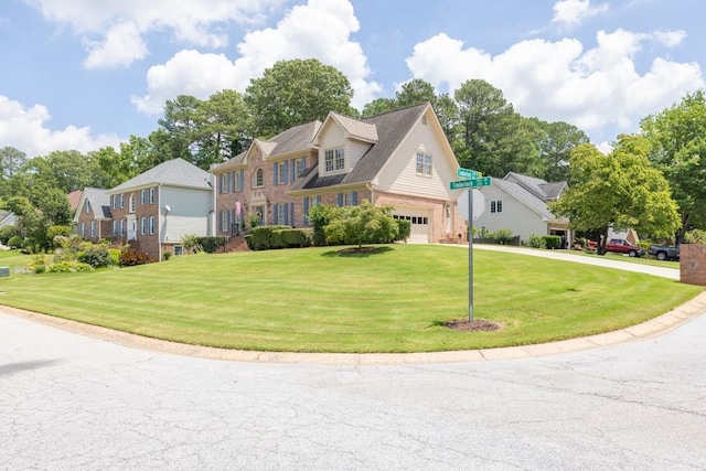 3574 Timberloch Trl, Snellville, GA 30039 - view of front facade featuring brick siding, a garage, a front yard, driveway, and a residential view