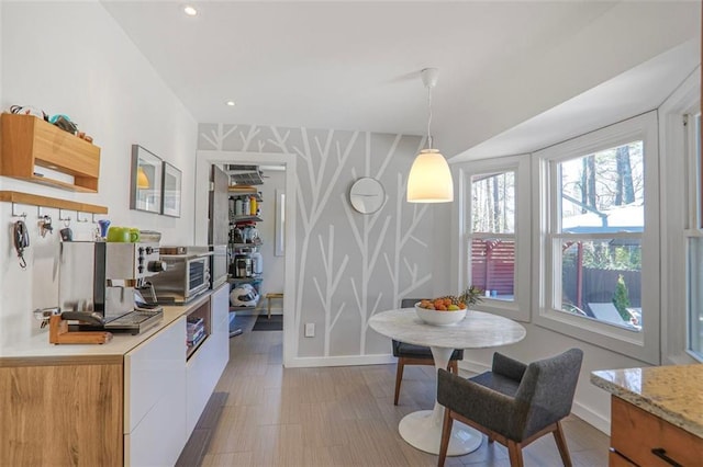 dining area with recessed lighting and baseboards