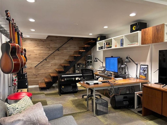 office with recessed lighting and wood walls