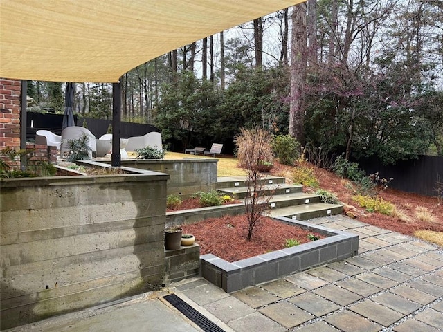 view of patio featuring fence