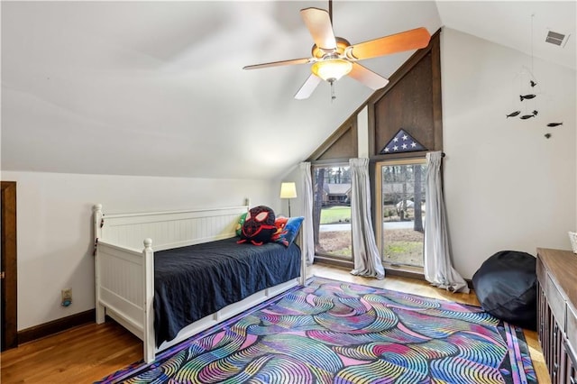 bedroom featuring baseboards, visible vents, lofted ceiling, ceiling fan, and light wood-style floors