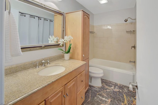 full bath with  shower combination, vanity, and toilet