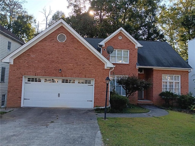 view of front property featuring a front lawn and a garage