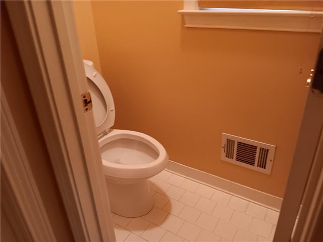 bathroom featuring tile patterned floors and toilet