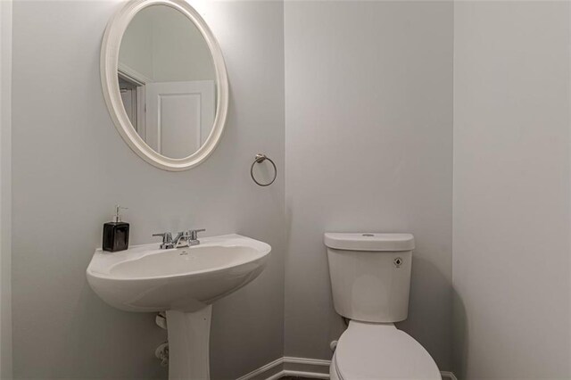 bathroom featuring toilet