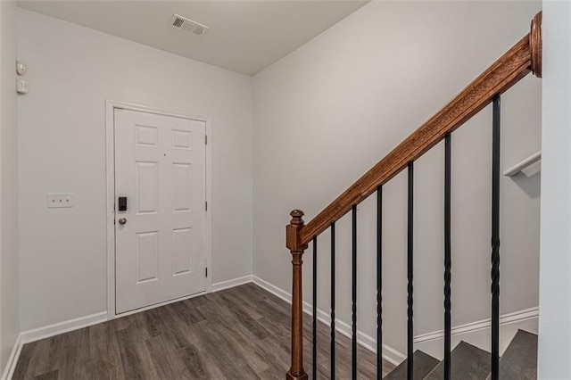 entrance foyer with dark hardwood / wood-style floors