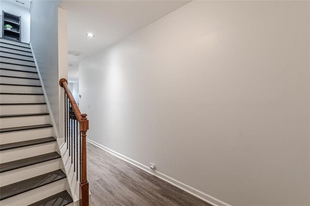 stairway with wood-type flooring