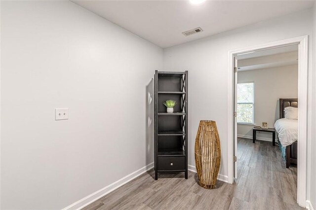 bedroom featuring wood-type flooring