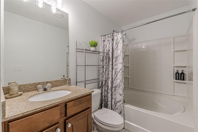 full bathroom with shower / bath combo with shower curtain, vanity, and toilet