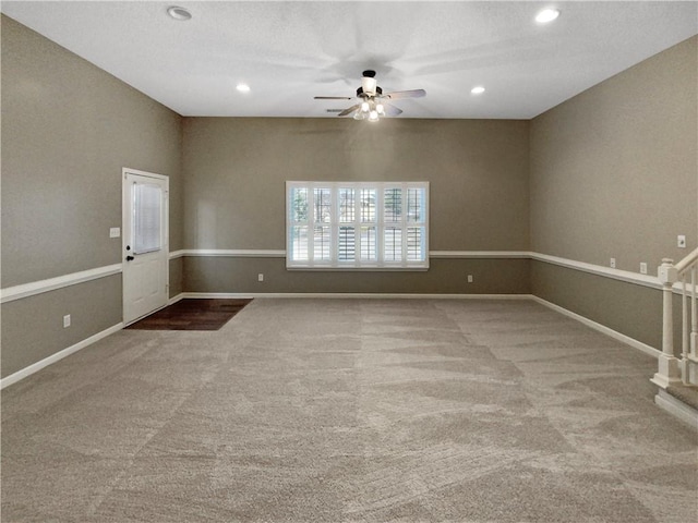 spare room featuring recessed lighting, baseboards, carpet, and a ceiling fan