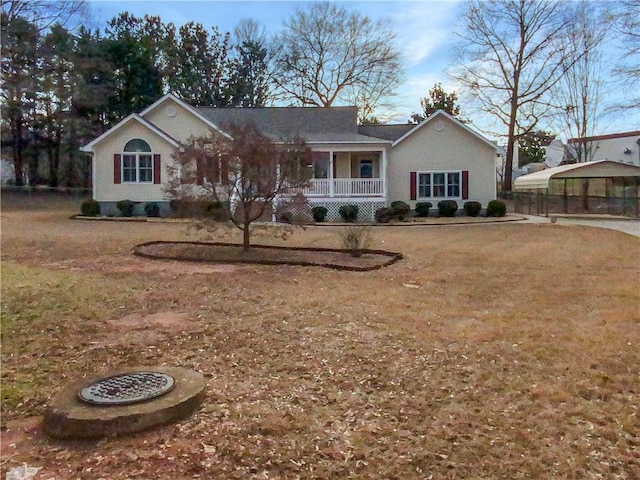 single story home with covered porch and a front yard