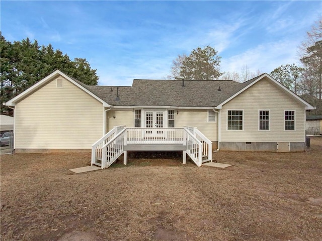 rear view of house featuring crawl space, a wooden deck, a yard, and stairway