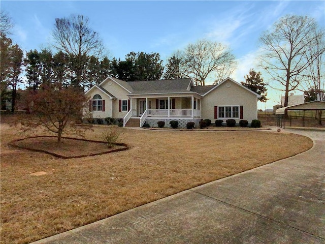 single story home with covered porch and a front yard