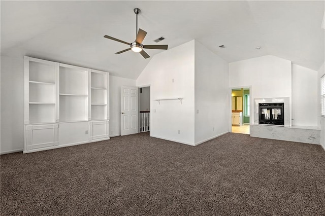 unfurnished living room featuring visible vents, ceiling fan, carpet flooring, high vaulted ceiling, and a multi sided fireplace