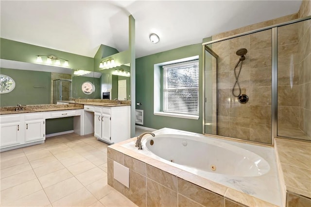 full bathroom with a stall shower, vaulted ceiling, vanity, tile patterned flooring, and a jetted tub