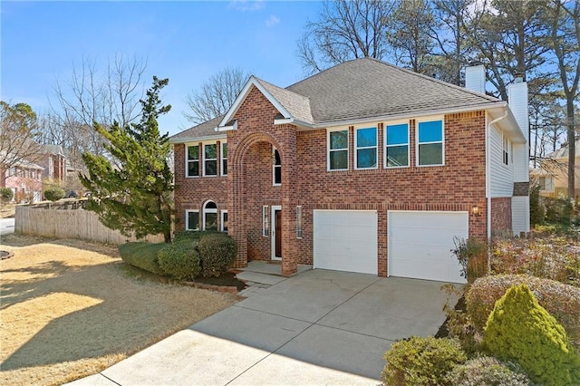 view of front facade featuring a shingled roof, a chimney, concrete driveway, and brick siding