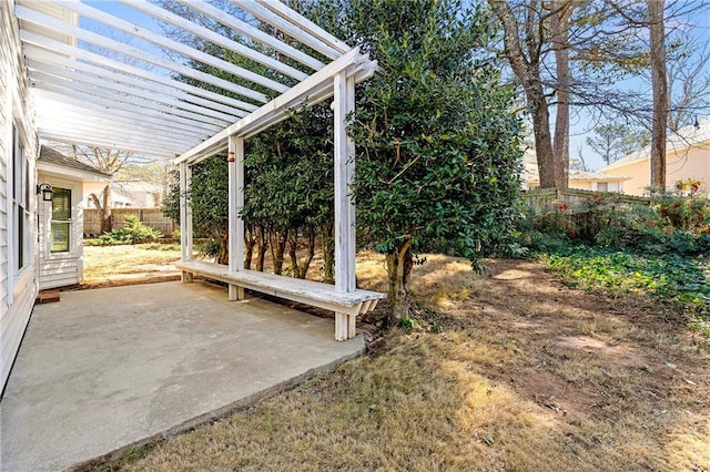 view of yard featuring a patio area, fence, and a pergola