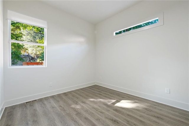 spare room featuring hardwood / wood-style flooring