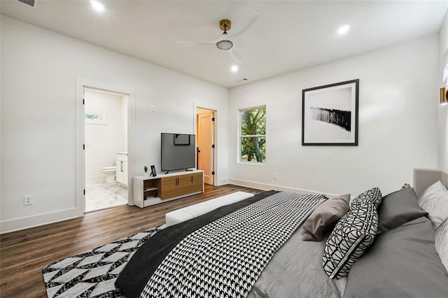 bedroom with ensuite bath, ceiling fan, and hardwood / wood-style flooring