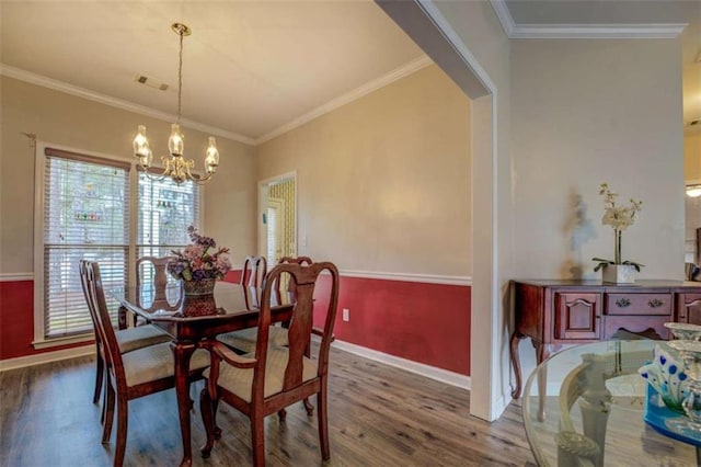 500 Nicole Ct SE, Conyers, GA 30094 - dining space featuring wood-type flooring, ornamental molding, and an inviting chandelier
