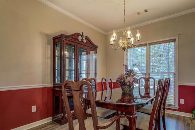 500 Nicole Ct SE, Conyers, GA 30094 - dining room featuring ornamental molding, dark hardwood / wood-style floors, and a chandelier