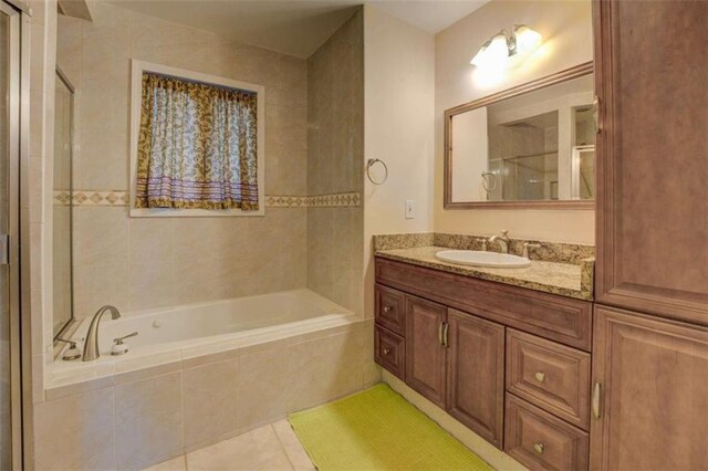500 Nicole Ct SE, Conyers, GA 30094 - bathroom featuring tile patterned flooring, vanity, and independent shower and bath