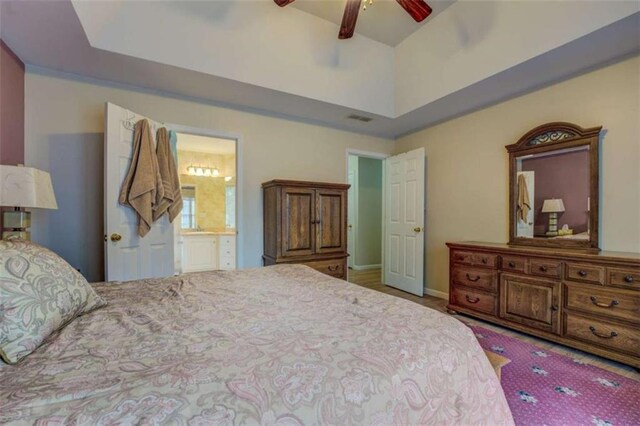 500 Nicole Ct SE, Conyers, GA 30094 - bedroom featuring ceiling fan, ensuite bathroom, and a raised ceiling