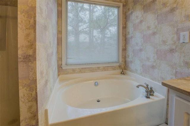 500 Nicole Ct SE, Conyers, GA 30094 - bathroom with vanity and a tub to relax in