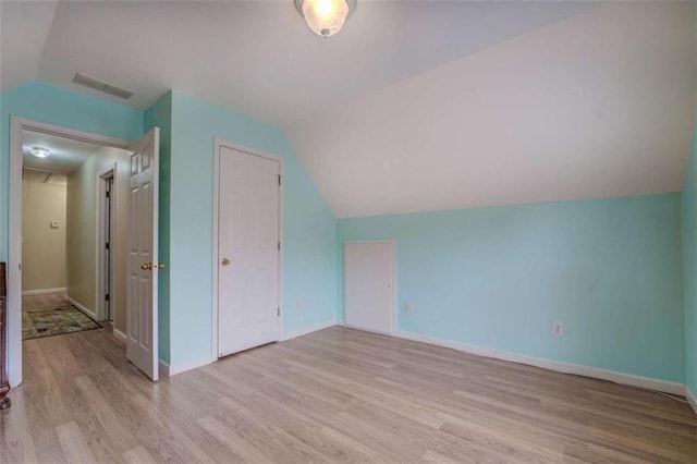 500 Nicole Ct SE, Conyers, GA 30094 - additional living space with lofted ceiling and light hardwood / wood-style floors