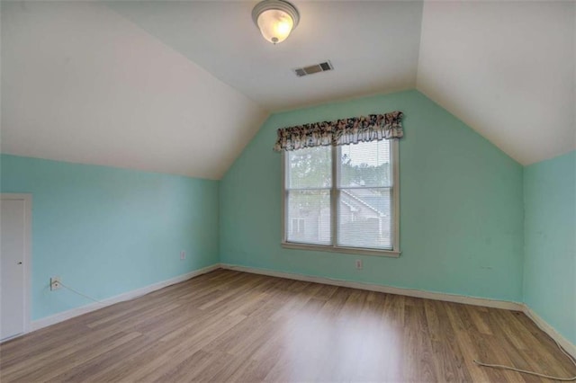 500 Nicole Ct SE, Conyers, GA 30094 - bonus room featuring vaulted ceiling and hardwood / wood-style floors