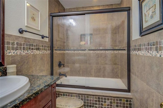 500 Nicole Ct SE, Conyers, GA 30094 - full bathroom featuring enclosed tub / shower combo, vanity, toilet, and tile walls