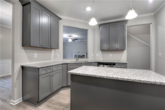 kitchen with sink, hanging light fixtures, stainless steel dishwasher, ceiling fan, and gray cabinets